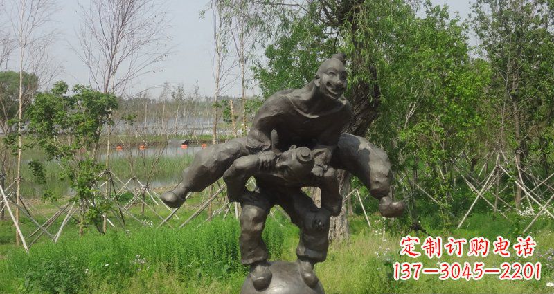 北京园林站在球上面跳山羊的人物景观铜雕
